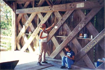 Students take measurements of each building member of the Spade Farm bridge