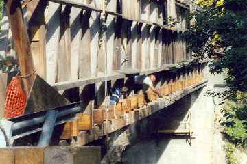 Union Village CB - Pounding trunnels to secure timber.