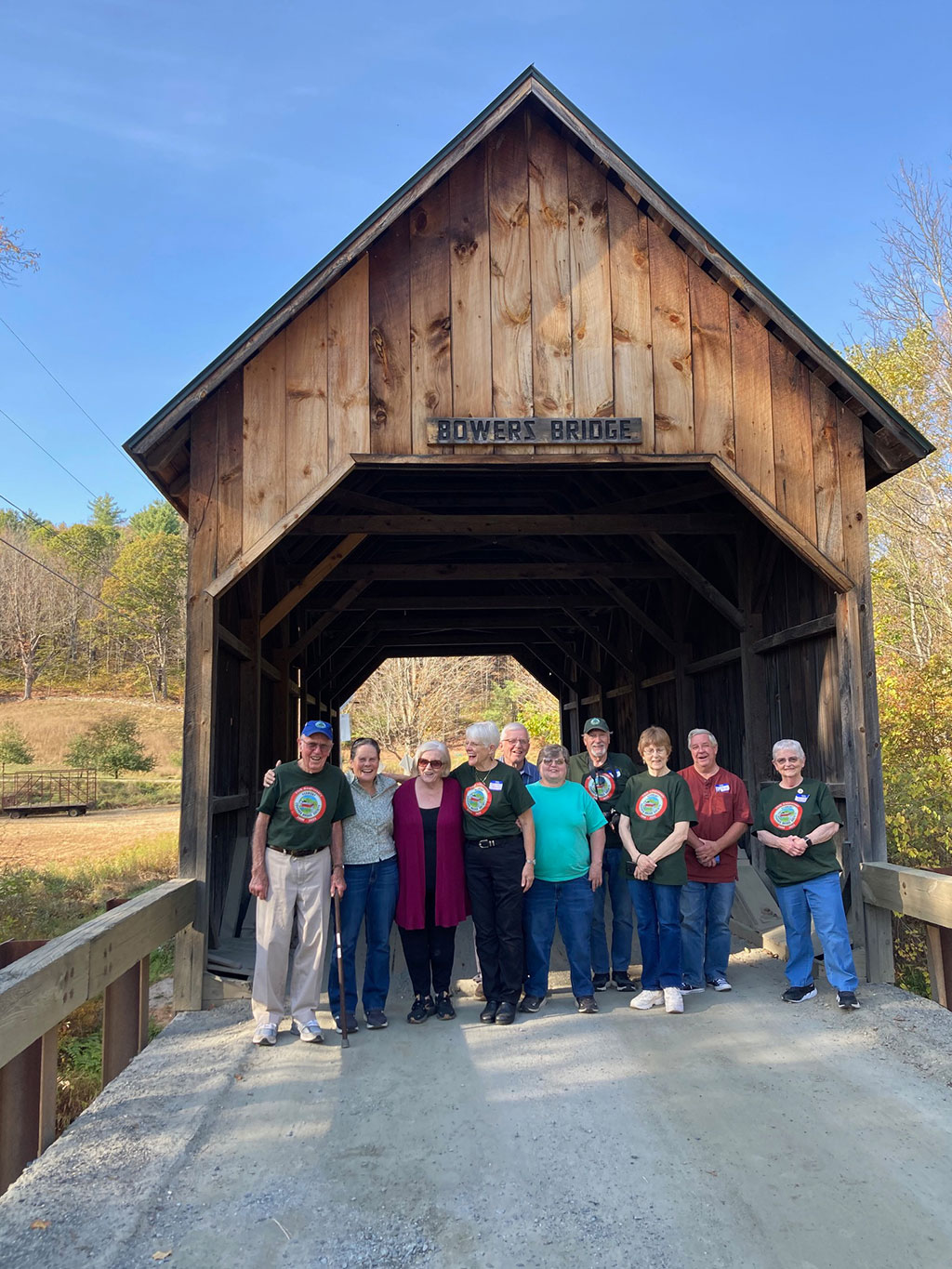Group of people gathered under the Bowers Bridge